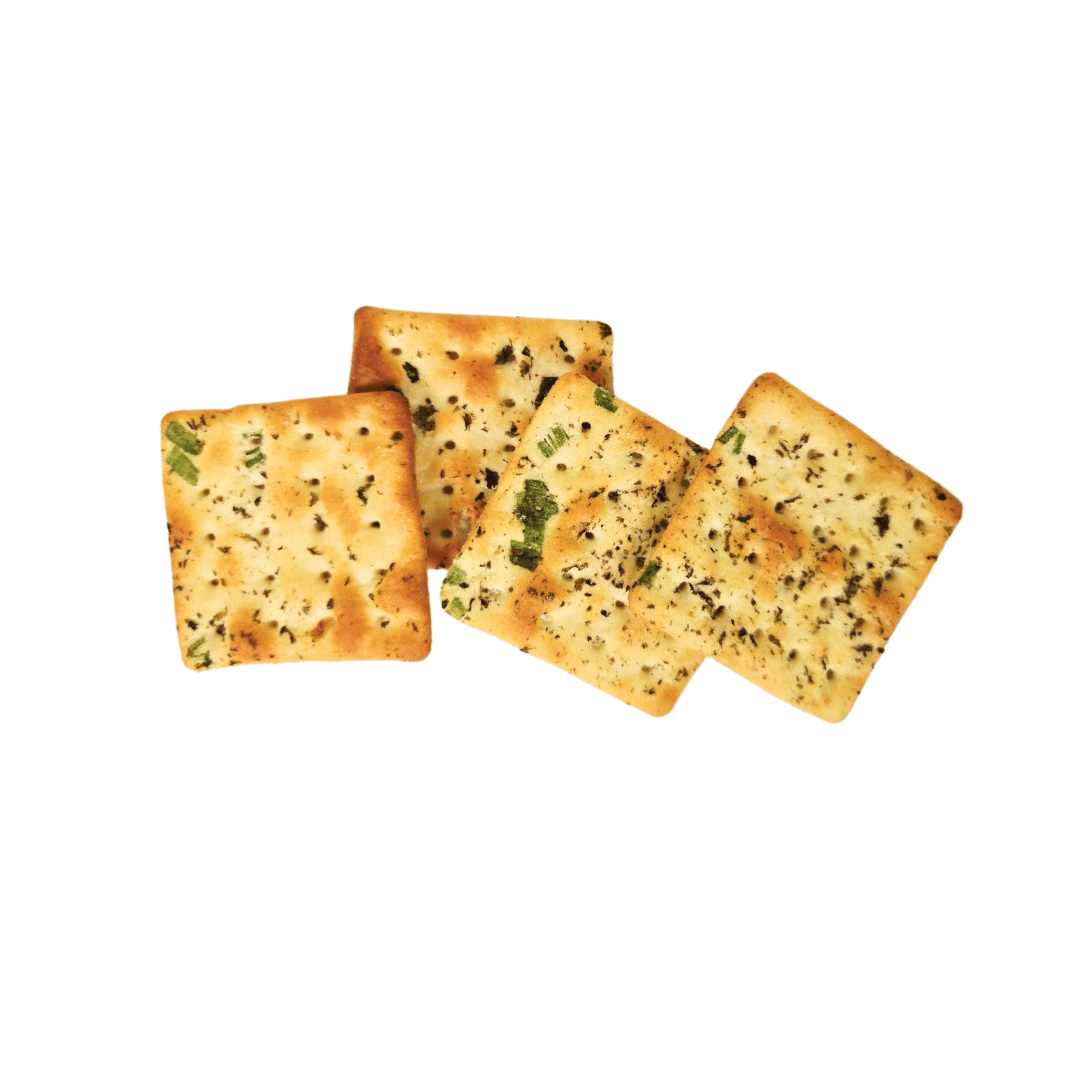 Four square seaweed green onion crackers on a white background